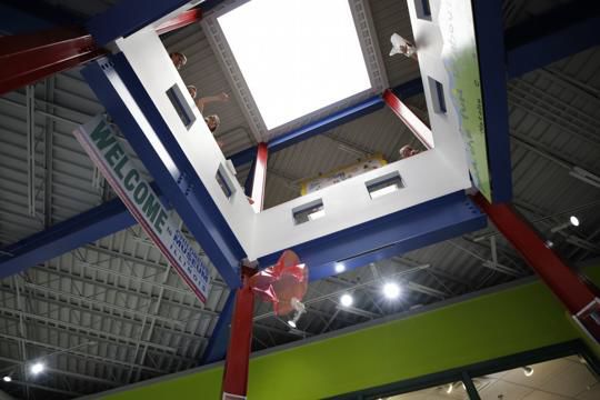 Parachutes fly in the Children's Museum of Illinois for the Lunar Landing STEAM program